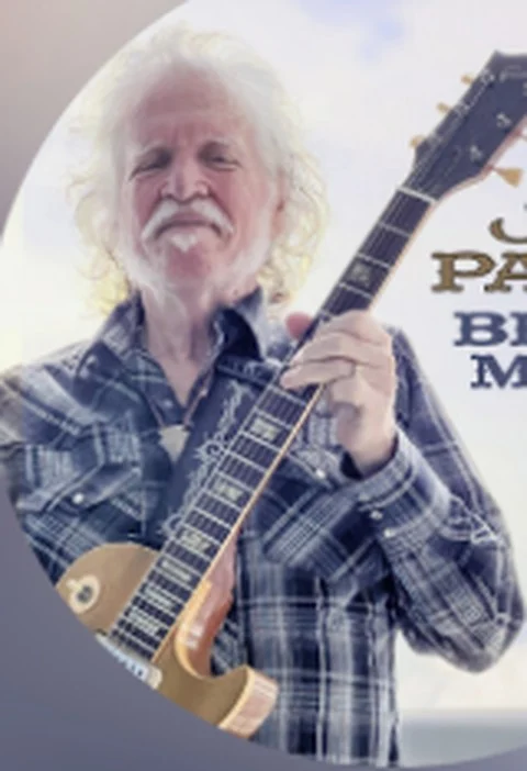 Portrait of blues musician Joe Payne with his guitar